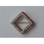 A good Art Deco ruby and diamond brooch of square