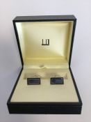 A boxed pair of Dunhill cufflinks decorated with e