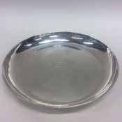 A George I circular silver strawberry dish, the ce