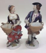 A pair of Continental figures decorated with gildi