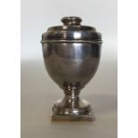 An unusual large silver nutmeg grater in the form
