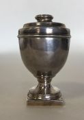 An unusual large silver nutmeg grater in the form