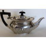 A small silver half fluted bachelor's teapot of ty