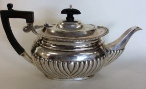 A small silver half fluted bachelor's teapot of ty