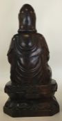 A large Chinese carved figure of a seated Buddha o