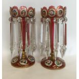 A good pair of cranberry glass lustres with gilded