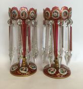 A good pair of cranberry glass lustres with gilded