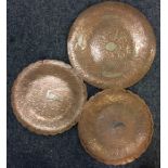 A pair of Eastern circular copper and silver inlai