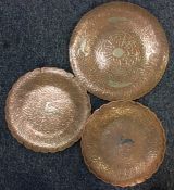 A pair of Eastern circular copper and silver inlai