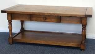 A good oak single drawer plank top occasional tabl