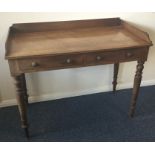 A Victorian mahogany wash stand on tapering suppor