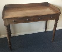 A Victorian mahogany wash stand on tapering suppor