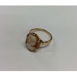 A 9 carat cameo ring in claw mount. Approx. 3 gram