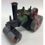 MAMOD: A small painted model of a steam roller. Es