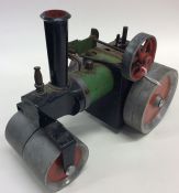 MAMOD: A small painted model of a steam roller. Es