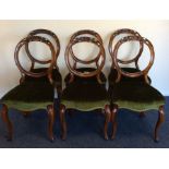 A good set of six mahogany dining chairs with scro