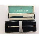 A boxed Parker pen together with two other Cross p