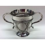 A Georgian half fluted two handled silver cup on s