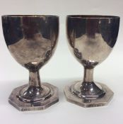 A pair of silver goblets with gilt interiors on re