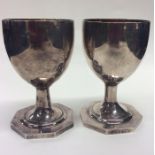 A pair of silver goblets with gilt interiors on re