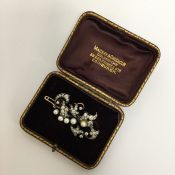 A large diamond brooch attractively decorated with