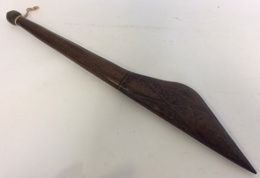 A tribal mallet with etched decoration. Est. £20 -