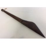 A tribal mallet with etched decoration. Est. £20 -