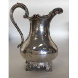 A good Victorian silver cream jug decorated with f