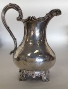 A good Victorian silver cream jug decorated with f