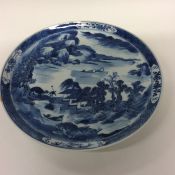 A 19th Century blue and white Chinese wall plate d