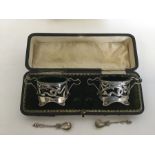A stylish boxed pair of silver salts and spoons wi