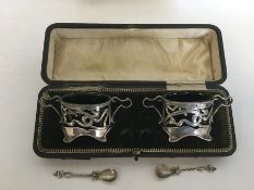 A stylish boxed pair of silver salts and spoons wi