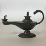 A small silver Aladdin's lamp with lift-off cover.