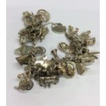 A heavy silver charm bracelet with heart shaped cl