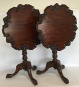 A pair of reproduction mahogany pillar tables deco