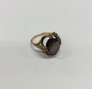 A heavy smokey quartz single stone ring in 9 carat