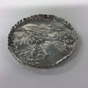A small circular Edwardian silver pin dish with co