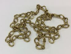 A good quality French 18 carat chain with ring cla