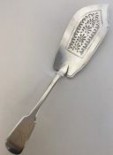 A Georgian silver fiddle pattern fish slice with p