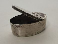 An oval bright cut Georgian silver snuff box with