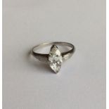 An attractive marquise single stone ring, the cent