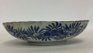 An Imari oval dish decorated with flowers and leav