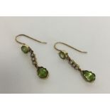 An attractive pair of Edwardian peridot and pearl