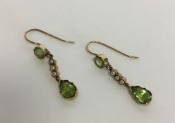 An attractive pair of Edwardian peridot and pearl