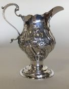 A good Georgian silver cream jug, the body attract