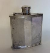 A good silver engine turned hip flask with hinged