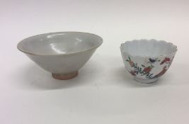 A good Antique Chinese tea cup with wavy edge toge