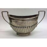 An Edwardian half fluted sugar bowl of typical des