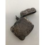 An Edwardian engraved silver vesta case decorated