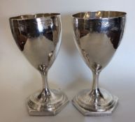 A pair of Georgian silver goblets with bright cut